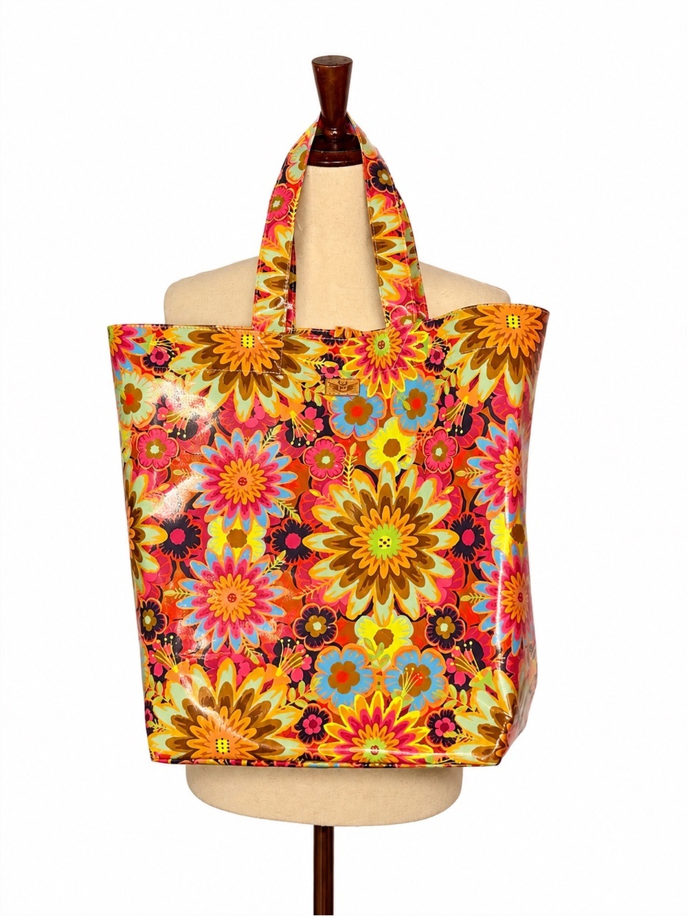 Consuela full size vinyl tote in retro print. Like new. Flat rectangular base.